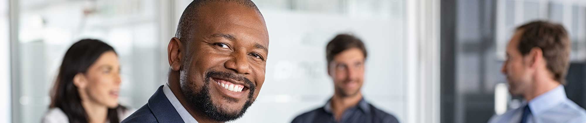 a business man smiling at the camera